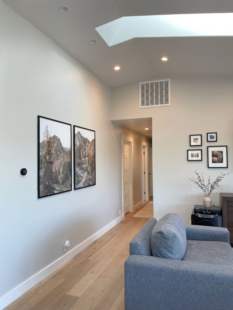 Light wood floor in hallway with Sherwin Williams warm gray paint color, Repose Gray. Kylie M.