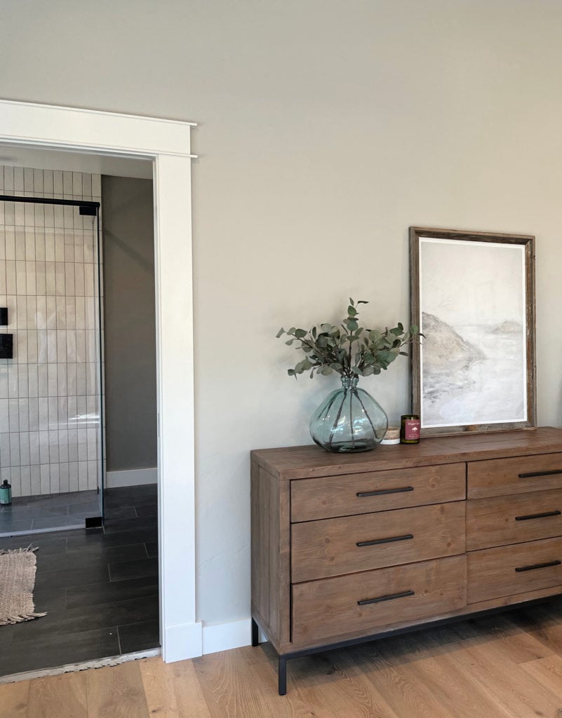 Light wood flooring, dresser with Sherwin Williams Repose Gray, best warm gray paint color on walls. Kylie M.