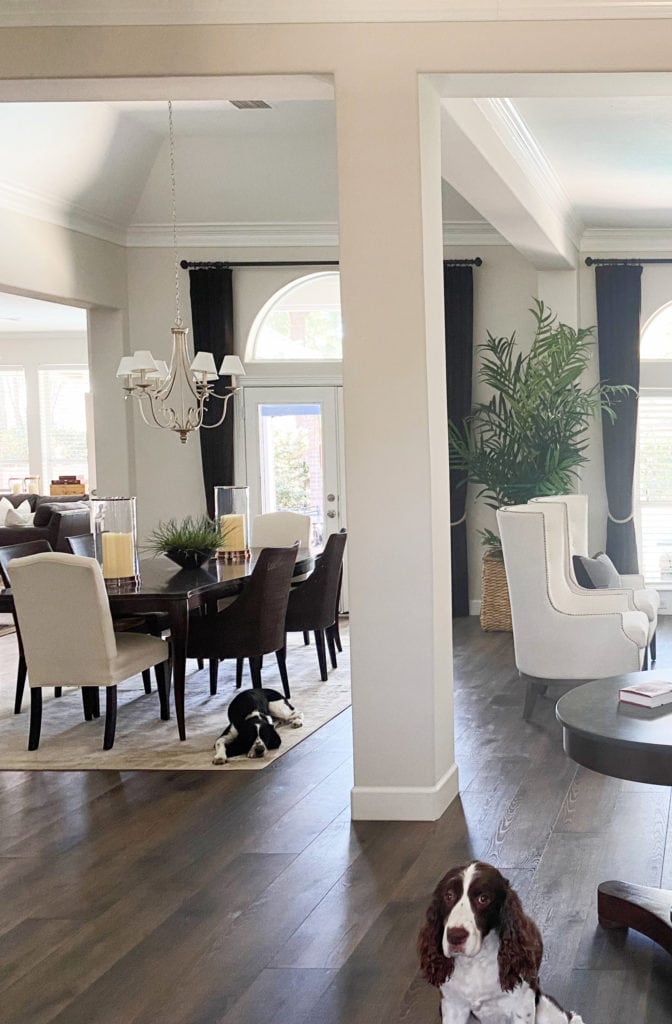 Living room and dining room, dark wood floor, Benjamin Moore Winds Breath off white paint color on walls, Kylie M Interiors Edesign