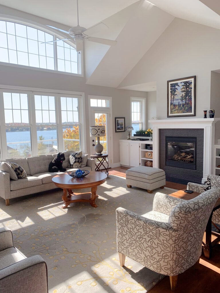 Ocean or lake home, Sherwin Williams Agreeable Gray, vaulted ceiling in living room with neutrals. Kylie M.