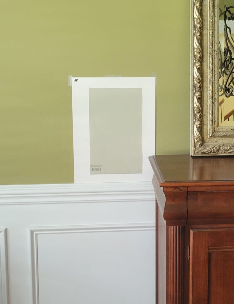 Sherwin Williams Jogging Path, greige paint color, white wainscoting, red cherry wood furniture