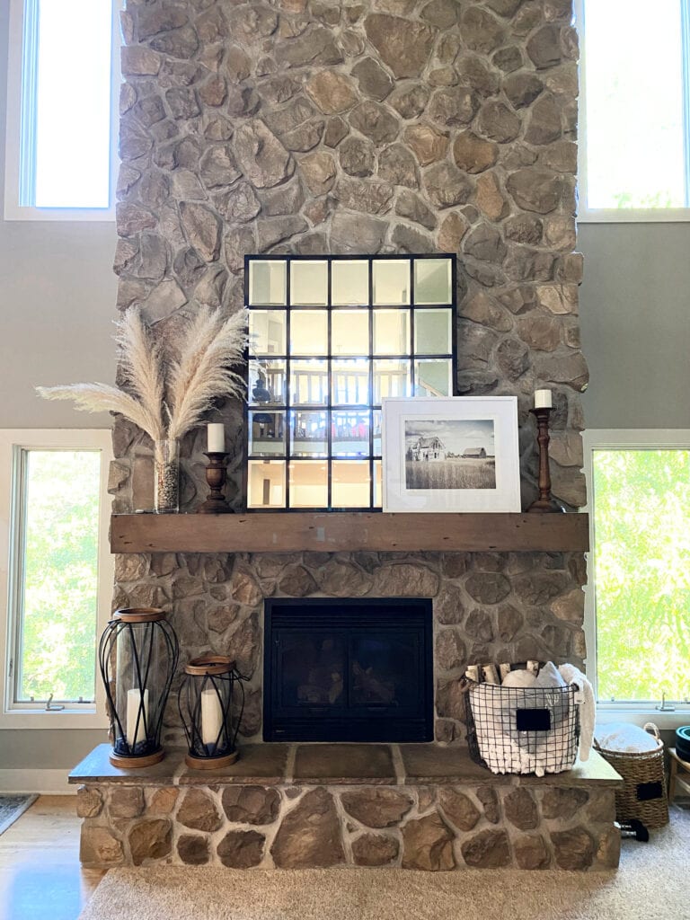 Stone fireplace, vaulted ceiling, wood beams, gray beige, greige warm tones and home decor.