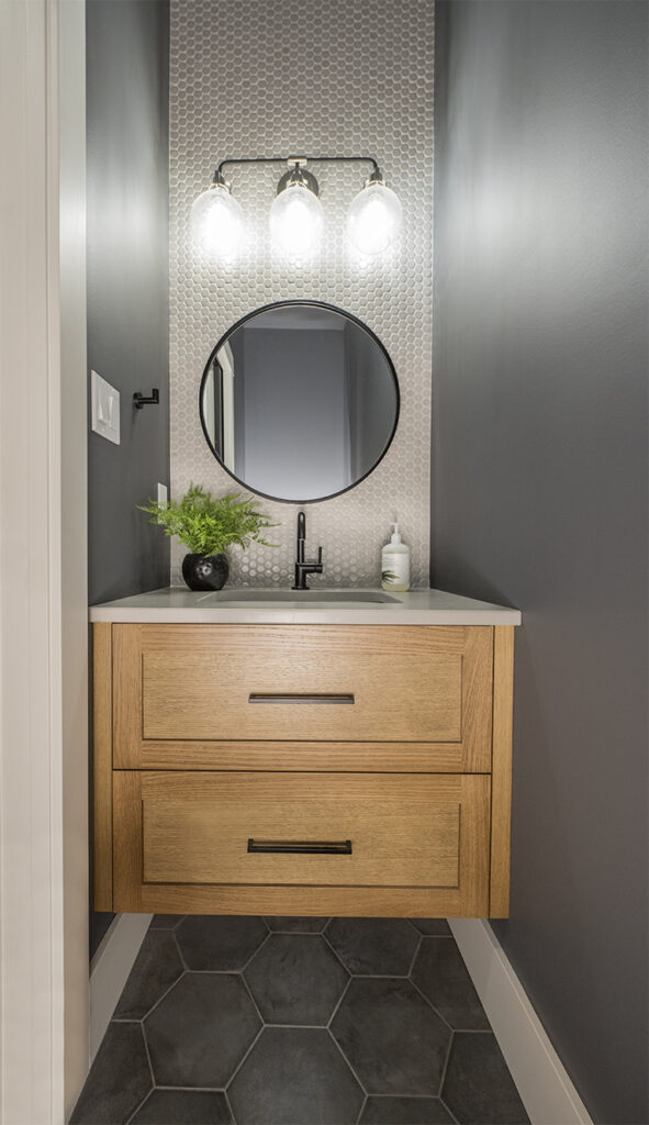 Small bathroom, powder room, Benjamin Moore Stormy Sky, best dark colour, oak vanity, penny tile, hexagon floor tile, black fixtures, Kylie M Edesign