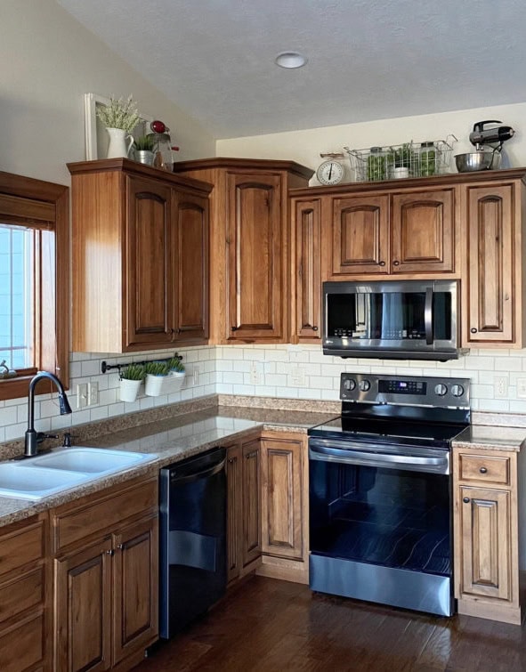 wood walnut tone cabinets, laminate granite look countertop, handpainted subway tile backsplash, stainless, Kylie M Interiors best paint colors