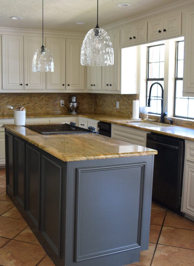 Painted wood kitchen cabinets, island Benjamin Moore Ashwood Moss, green grey. orange tile floor, travertine, granite countertop, off-white beige Moderate White, Sherwin