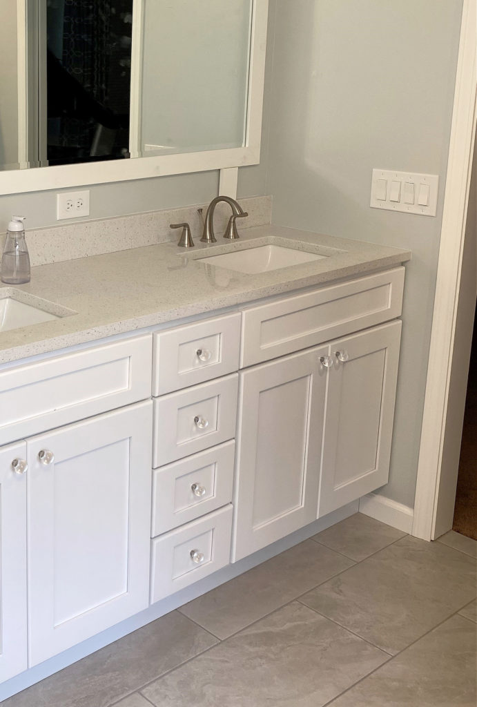 Benjamin Moore ice Cap, best blue green paint colour, bathroom greige taupe warm gray floor tile, white vanity. Kylie M