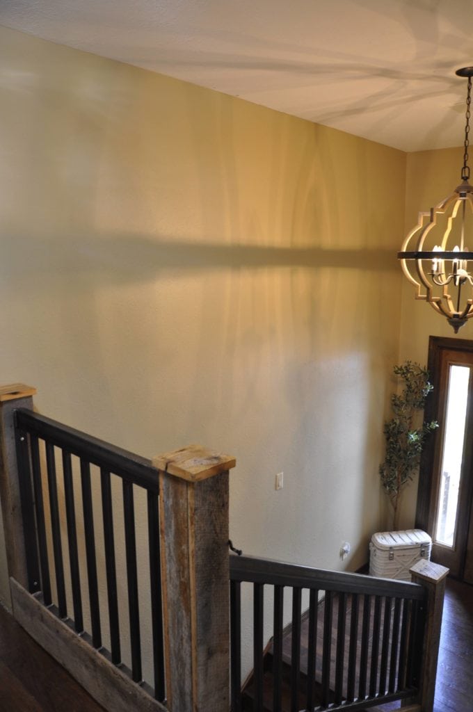 Foyer, Sherwin Williams Basket Beige with light on.