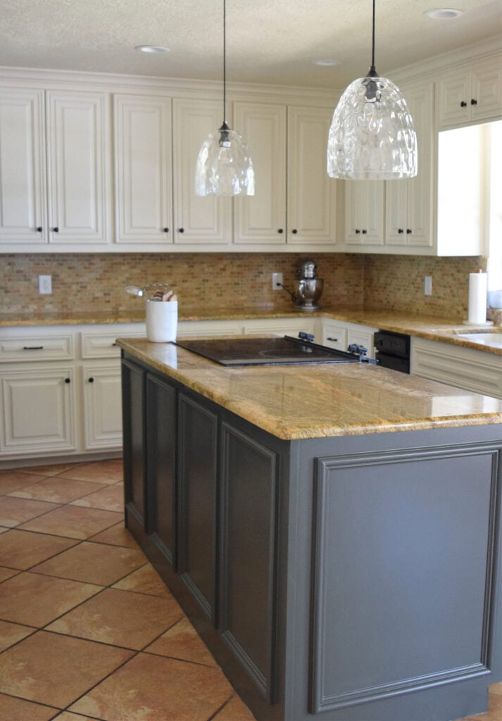 Benjamin Moore Ashwood Moss, Gray green dark island paint color, orange terra cotta colors in tile floor, off-white beige, Moderate White cabinets, travertine. Kylie M Edesig (1)