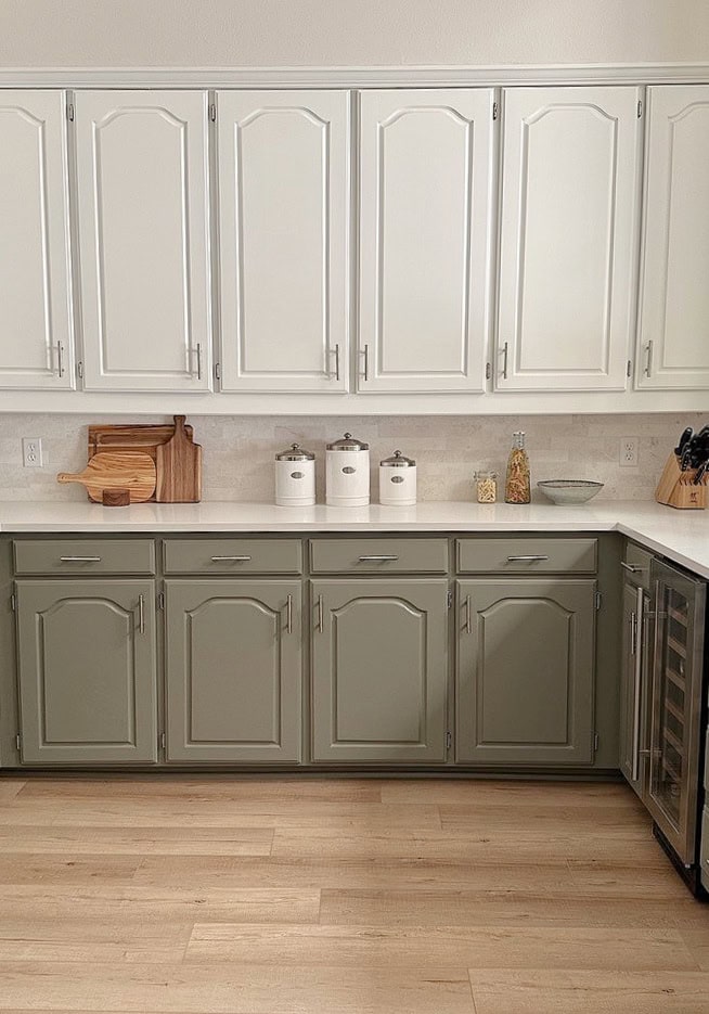 Maritime White, beige on walls, Benjamin Moore White Dove painted maple upper cabinets, green lower cabinets, Antique Pewter, cathedral style, white quartz.