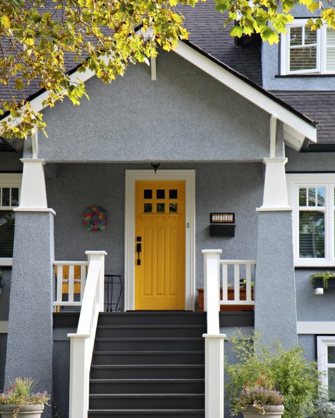 yellow front door, gray house, dark gray steops, white trim. best yellow front door colors