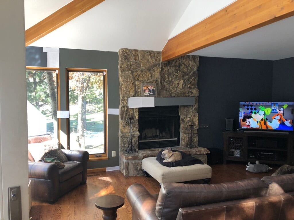 Sherwin Williams Grizzle Gray compared to Porpoise beside brown stone fireplace, wood beams. Dark accent or feature wall ideas. Kylie M