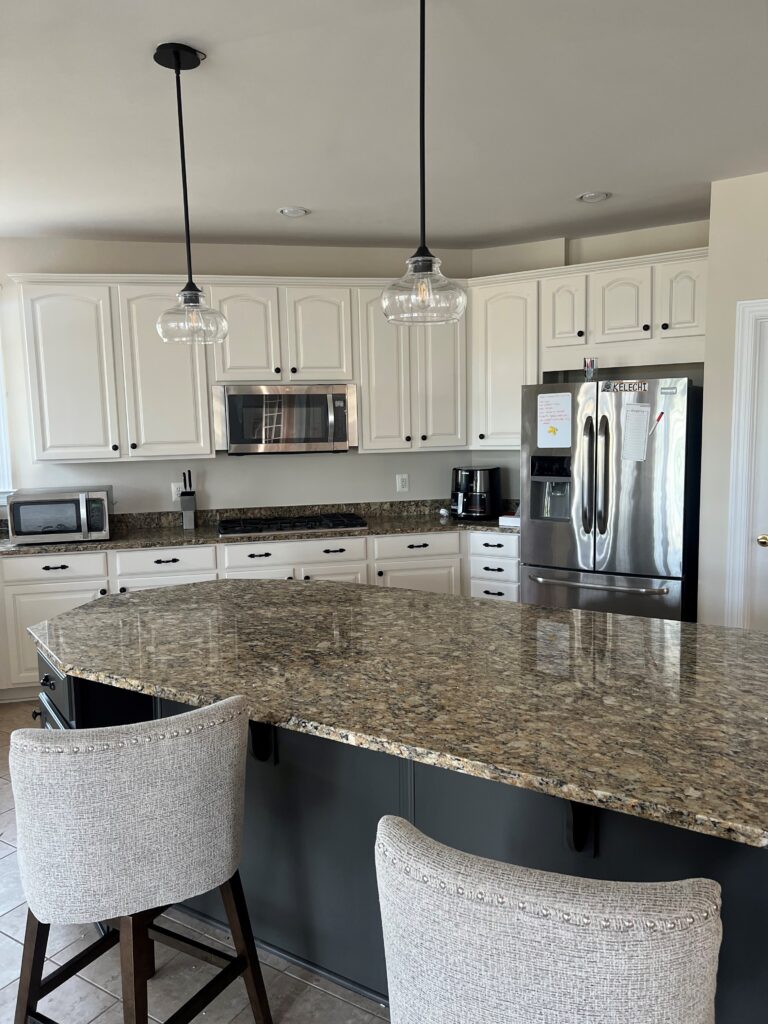 Beige Santa Cecelia similar to Giallo Ornamental granite countertops, beige tile floor, est painted cabinet colors, off-white beige. Iron Ore island