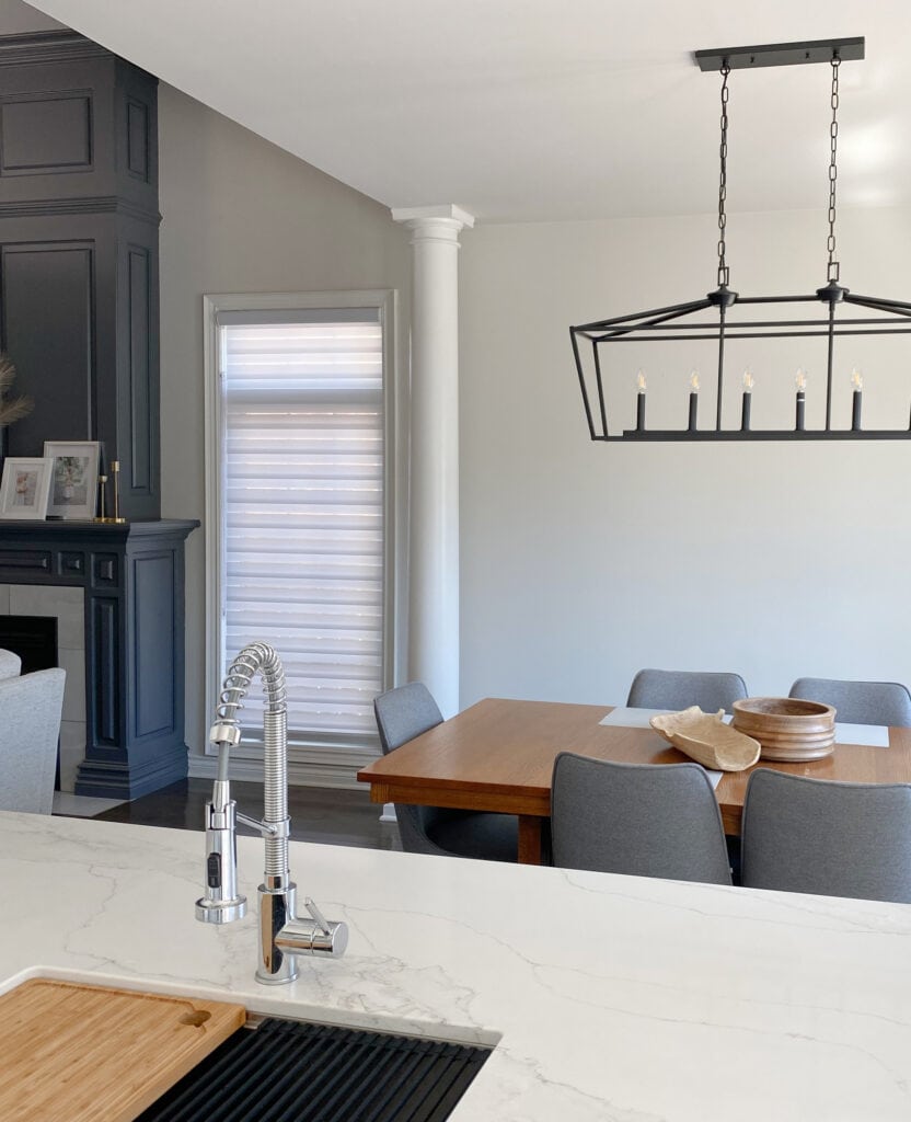 MSI CALACATTA IZARO, Benjamin Moore Charcoal Slate, Sherwin City Loft, open living and dining room, beam separating. Kylie M online paint consultant