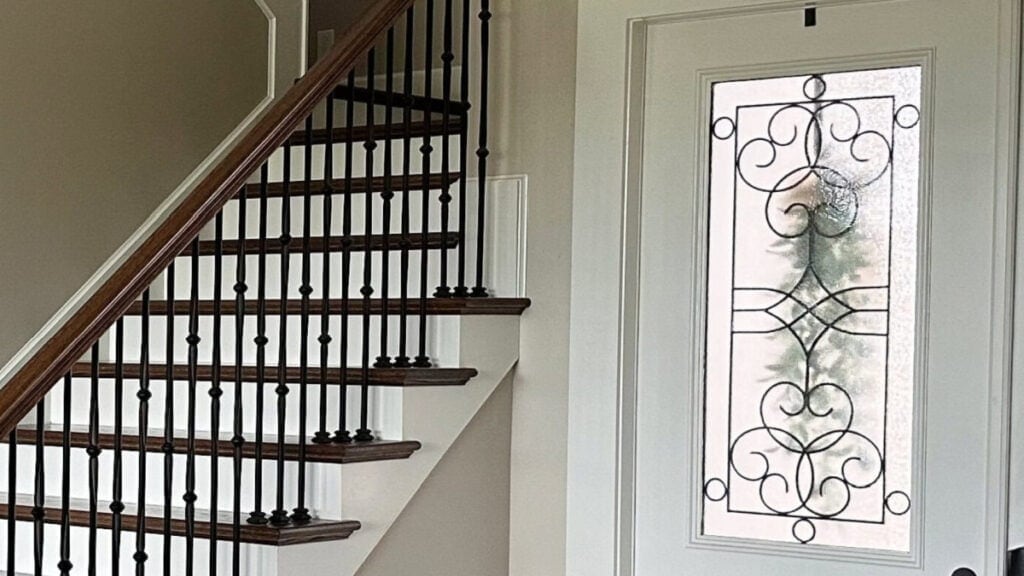 Sherwin Williams Alabaster on trim and door and stair risers with Accessible Beige walls