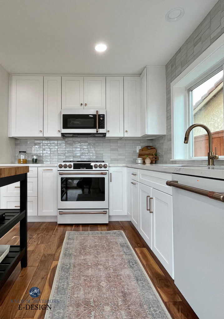 Articraft cabinets, Asheville cotton, MSI CALACATTA IZARO WHITE QUARTZ COUNTERTOP, ikea island, wood floor, GE Cafe white appliances, champagne brass, cle zellige weathered wood subway size backsplash tile. Kylie M Online paint consulting.