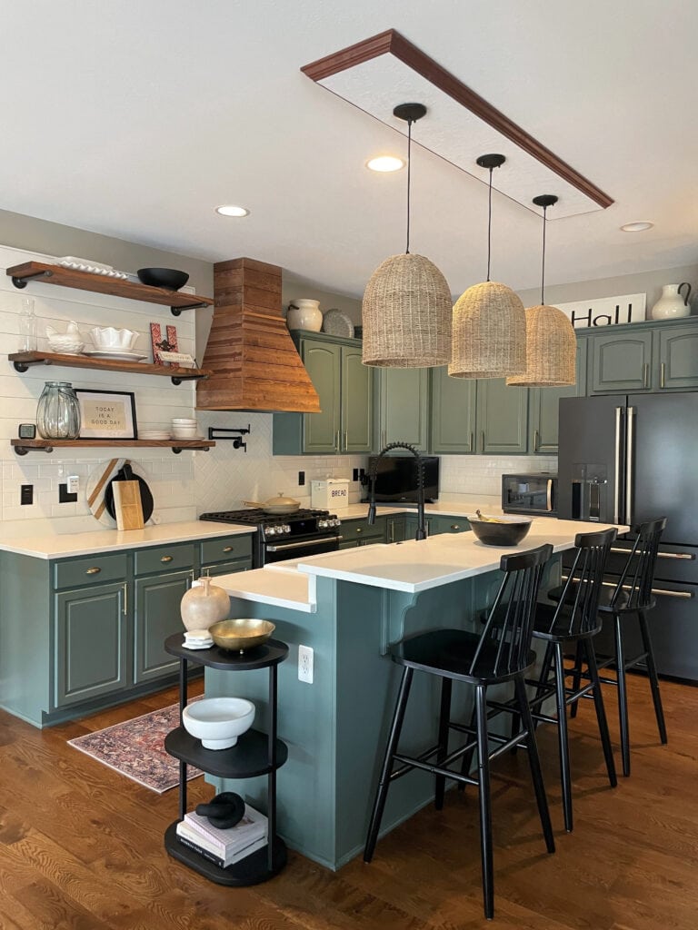 Benjamin Moore Caldwell Green painted wood cathedral arched kithen wood cabinets, floating shelves, subway tile backsplash, white quartz countertop, raised bar island