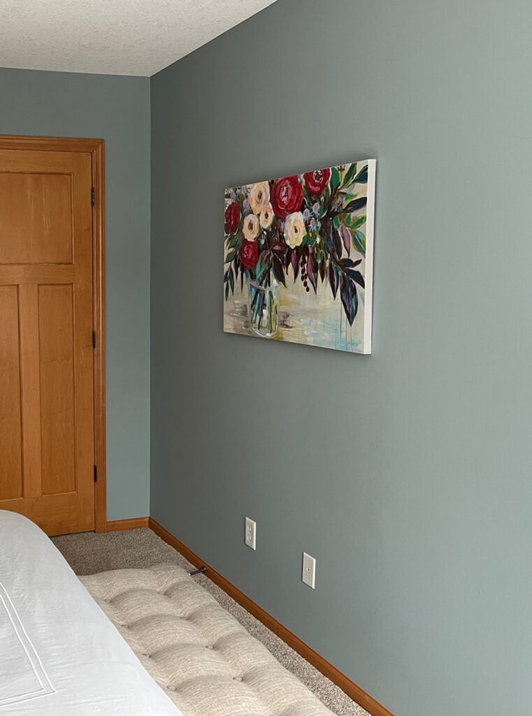 Benjamin Moore Mount Saint Anne, beige carpet, orange stain wood trim and doors. Best blue green gray paint color. Kylie M Online paint color expert