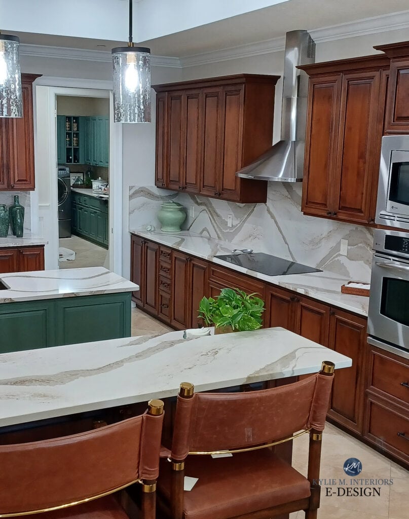 Cherry wood kitchen cabinets, Accessible Beige paint on walls, lightenedupdate with Cambria Brittanica Gold, green painted kitchen island, quartz backsplash, travertine tile. Kylie M Edesign