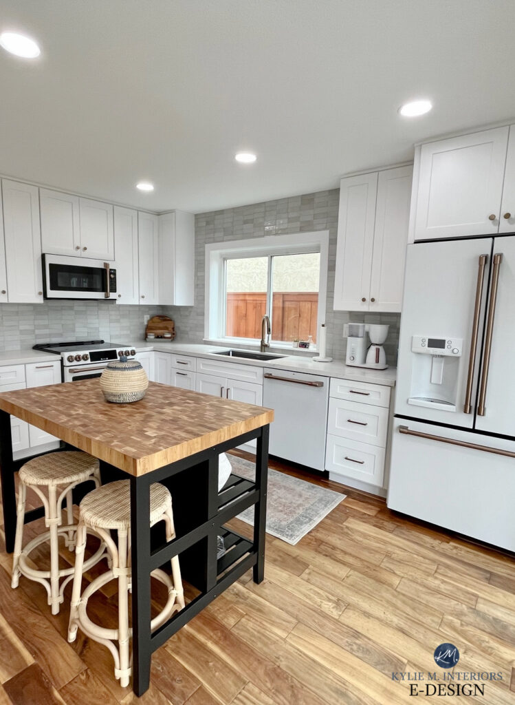 GE Cafe white appliances, champagne brass handles, ikea black and butcherblock island, mis calcatta izaro white quartz countertop. Zellige CLE Weathered Wood