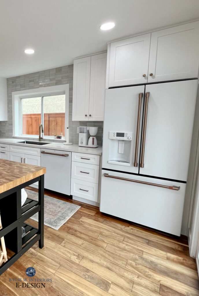 GE Cafe white fridge and dishwasher, champagne brass, wood floor. White cabinets, MSI WHITE QUARTZ COUNTERTOPS CALACATTA IZARO, IKEA ISLAND