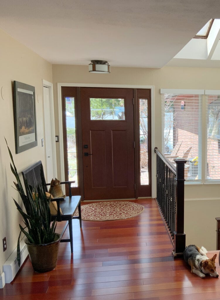 Manchester Tan with exotic red tone wood floor. Man tan is wrong color for this space. Foyer.