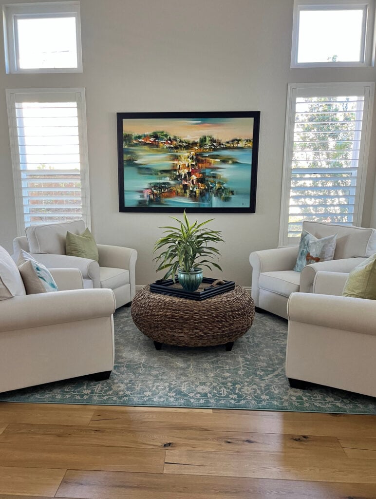 Sherwin Williams Neutral Ground, wood floor, windows, best neutrla tan beige paint color, 4 club chairs conversation setting