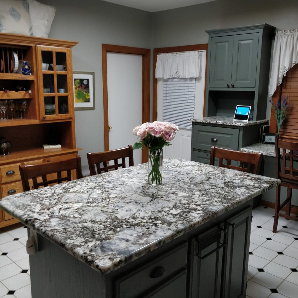 Sherwin Williams Night Owl on painted wood oak cabinets, vinyl white and black floor, wood trim, best shade of green paint
