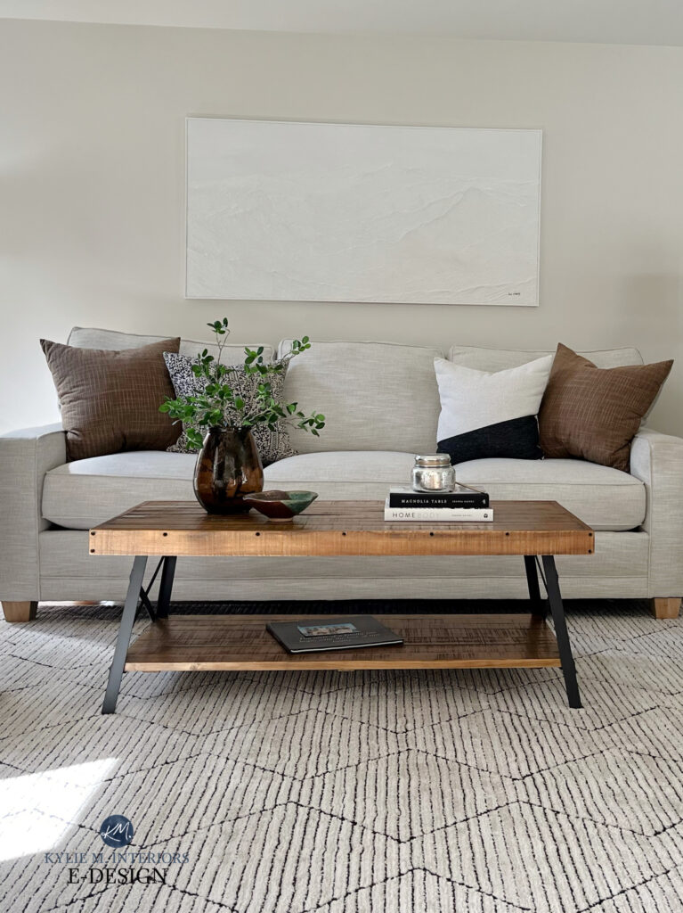 Taupe, warm gray, greige fabric sofa, area rug, coffee table home decor, Sherwin Williams Egret White paint color on walls. Kylie M Online paint color expert