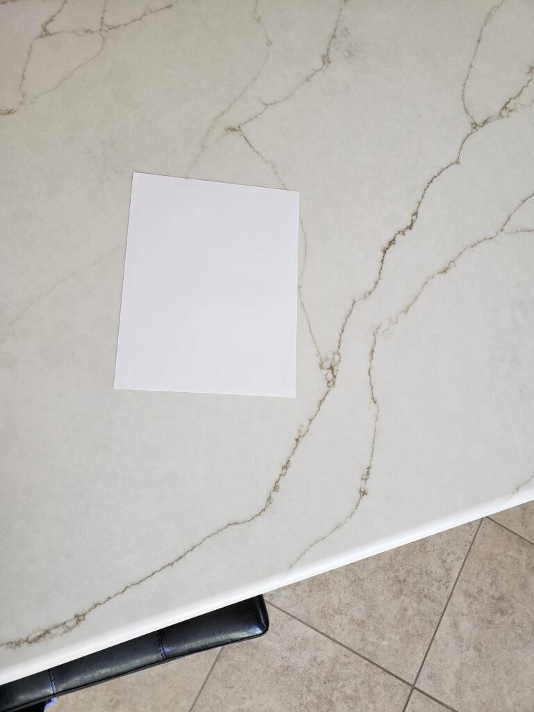 Vadara Sereno gold quartz countertop with beige tile floor. kitchen update ideas with Kylie M Interiors ONline paint color consultant and expert (3)