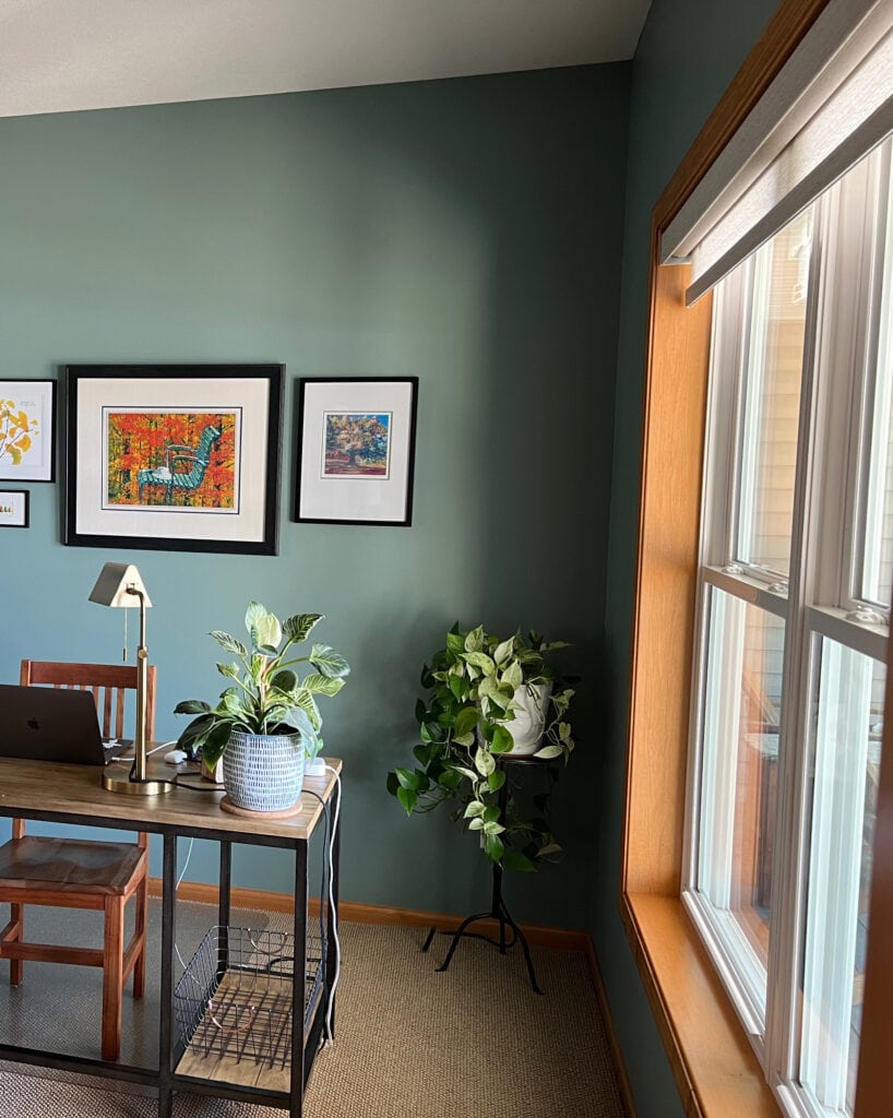 BEnjamin Moore Knoxville Gray walls in a home office with beige carpet and orange wood trim