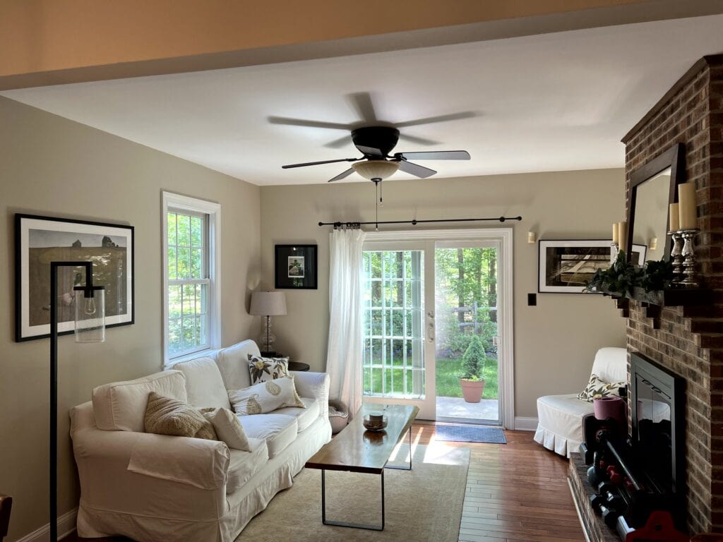 edgecomb gray living room, brick fireplace, sliding french style door, modern farmhouse vibe. freer