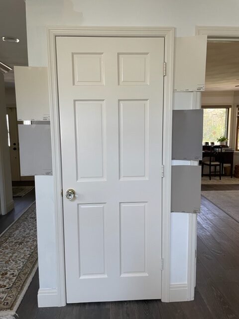 Samplize peel and stick paint samples with Sherwin Williams Antique White painted door and trim (same look for cream cabinets)