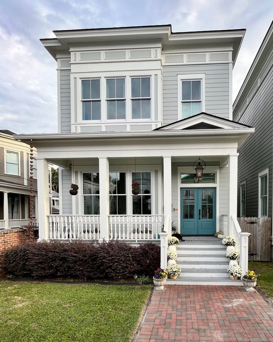Bella Blue, medium toned blue-green on front door, Half Moon Crest gray-green exterior painted siding, white trim, front porch, Kylie M Edesign