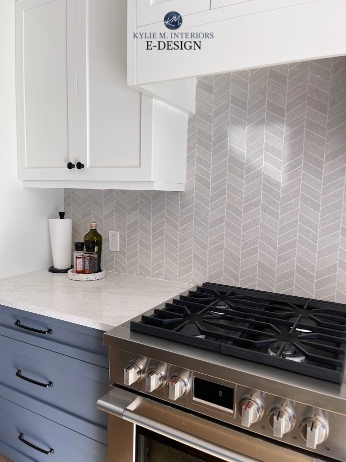 Benjamin Moore Britannia Blue, best medium blue paint color, Omnia white off white quartz countertop, Chevron tile backsplash, White Dove cabinets, Fulgor stainless steel range. KYlie M
