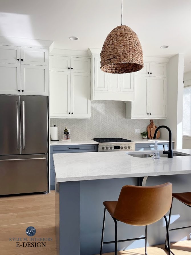Benjamin Moore Britannia Blue, painted kitchen lower cabinets, island, White Dove upper cabinets, walls, chevron tile backsplash, off-white quartz, stainless steel Fulgor appliances, white oak floor.