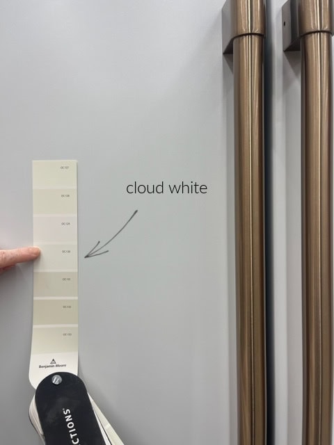 Benjamin Moore Cloud White is too warm and cream for the cool tone of GE Cafe White which matches Genesis White