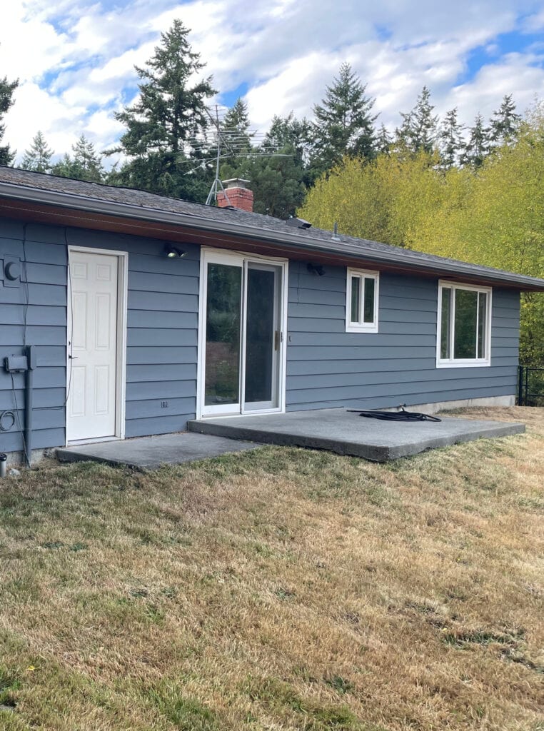 Benjamin Moore Gunmetal, best medium or dark gray paint color with undertones on exterior siding with no sun