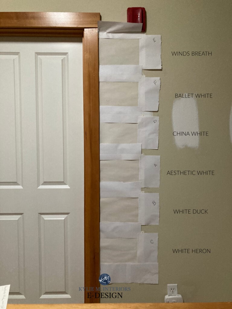 Dark hallway, wood fir trim, similar warm neutral paint colors, Winds Breath, BAllet White, White Duck, White Heron, Aesthetic White, China White. Kylie M