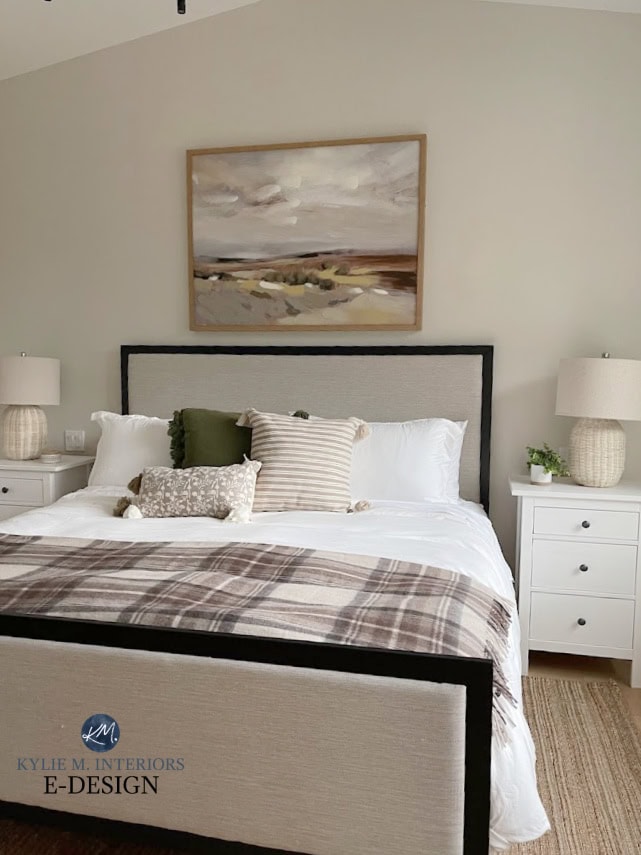 Primary bedroom with upholstered bed frame, linens, wicker lamps, ikea side table, Urban Barn art, Sherwin Williams Aesthetic White off white beige paint color on walls. KYlie M (1)