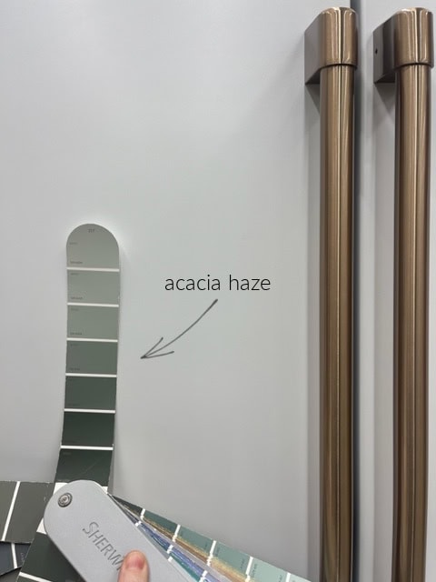 Sherwin Williams Acacia Haze with GE Cafe white appliances, green cabinet color, also showing Oyster Bay and Retreat, Kylie M Color expert