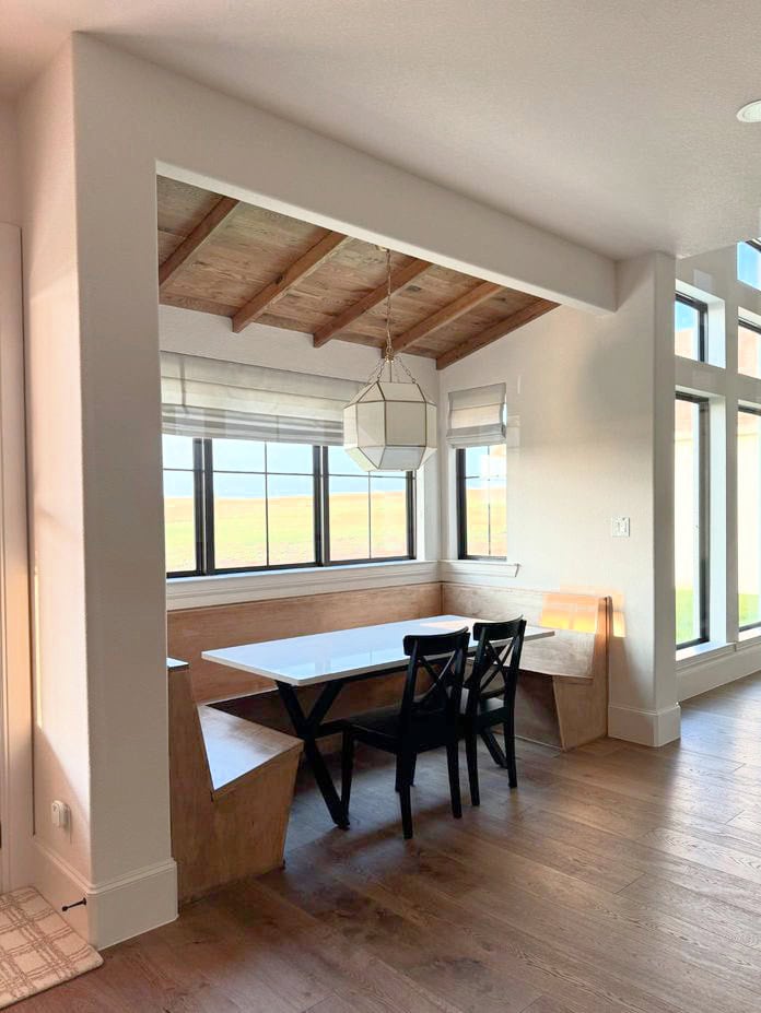 Sherwin Williams Aesthetic White in eating nook with u shape bench, wood ceiling and floor, best off-whitebeige