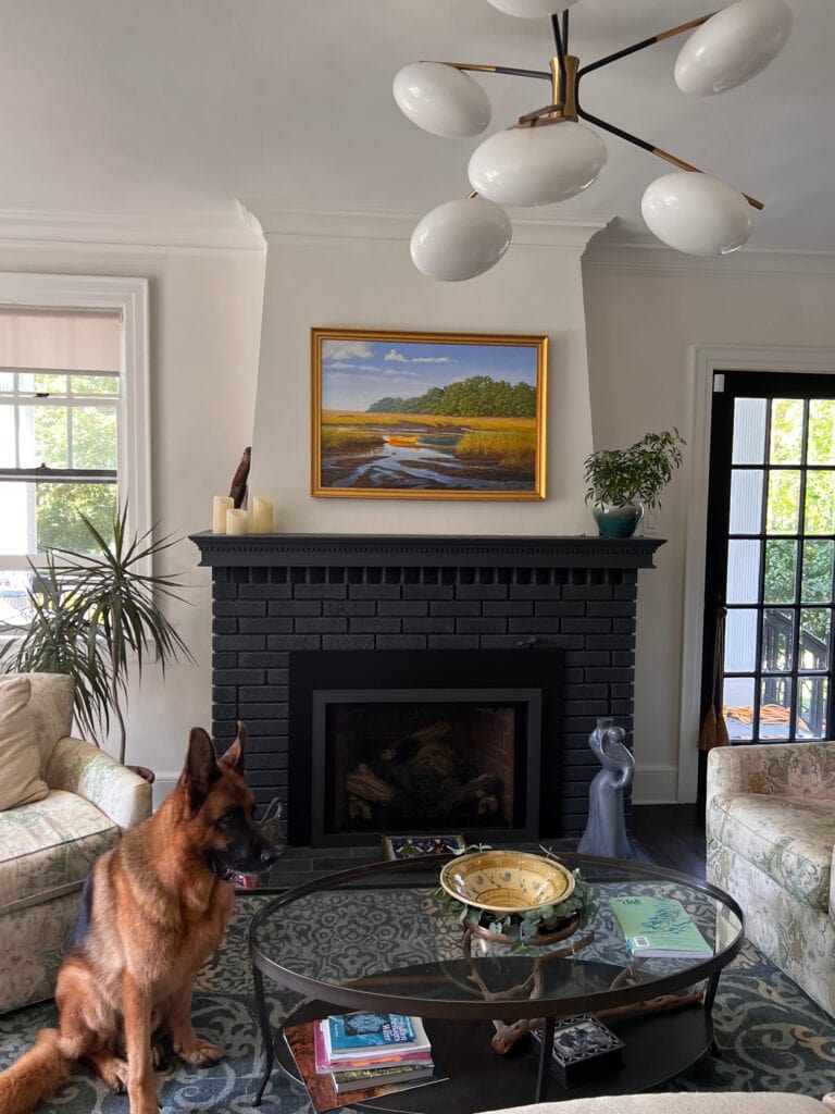 Sherwin Williams Alabaster white paint color on walls, Extra White trim, painted black brick fireplace, living room or family room design