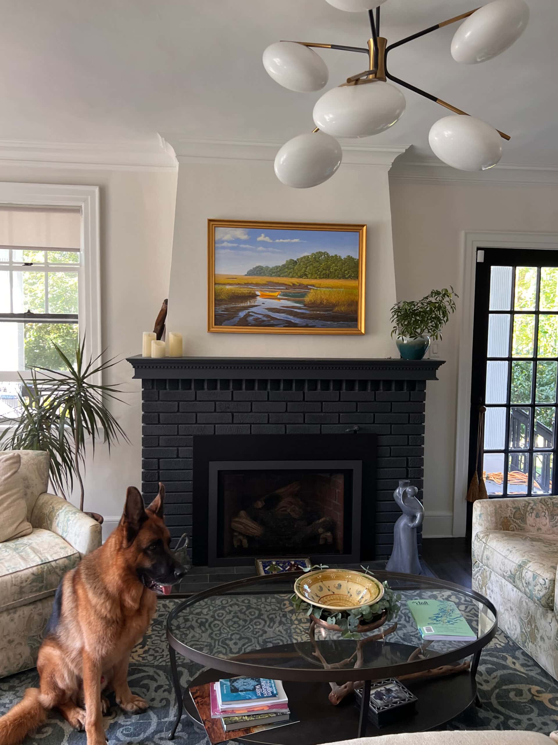 Sherwin Williams Alabaster white paint color on walls, Extra White trim, painted black brick fireplace, living room or family room design
