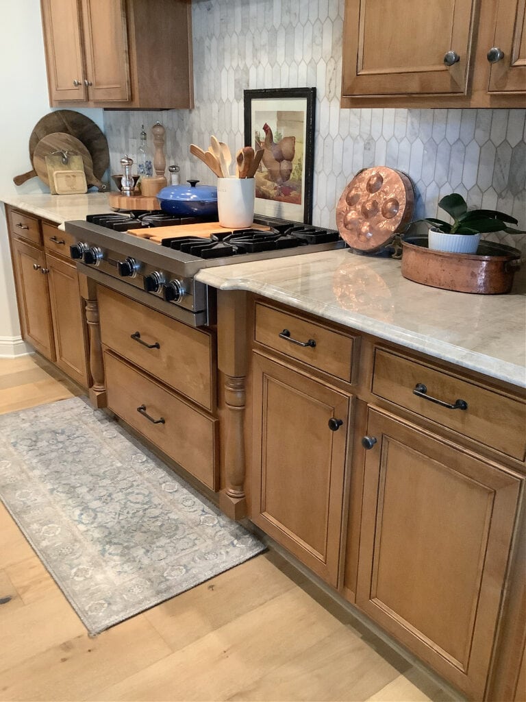 Wood cabinet UPDATE IDEAS, Taj Mahal quartzite, old world feel, zellige tile backsplash, wood floor. Kylie M