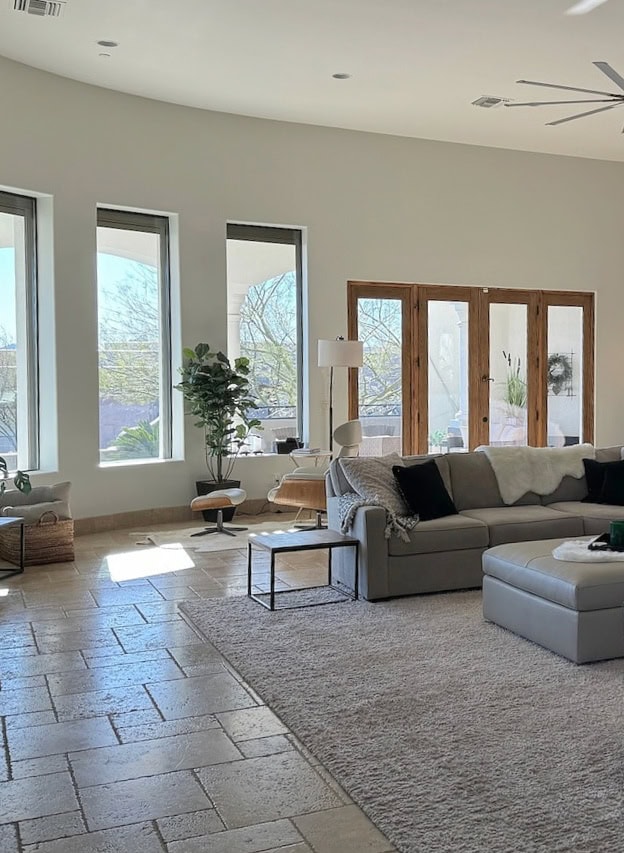 Benjamin Moore Dove Wing, off-white paint color with travertine tile floor, windows, home decor.