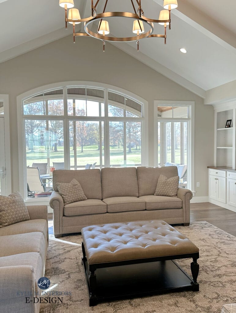 living room great room, vaulted cathedral ceiling, chandelier, Benjamin Moore Edgecomb Gray, Sherwin Pure White trim, sofas, white built ins, arched window. Kylie M Interiors edesign