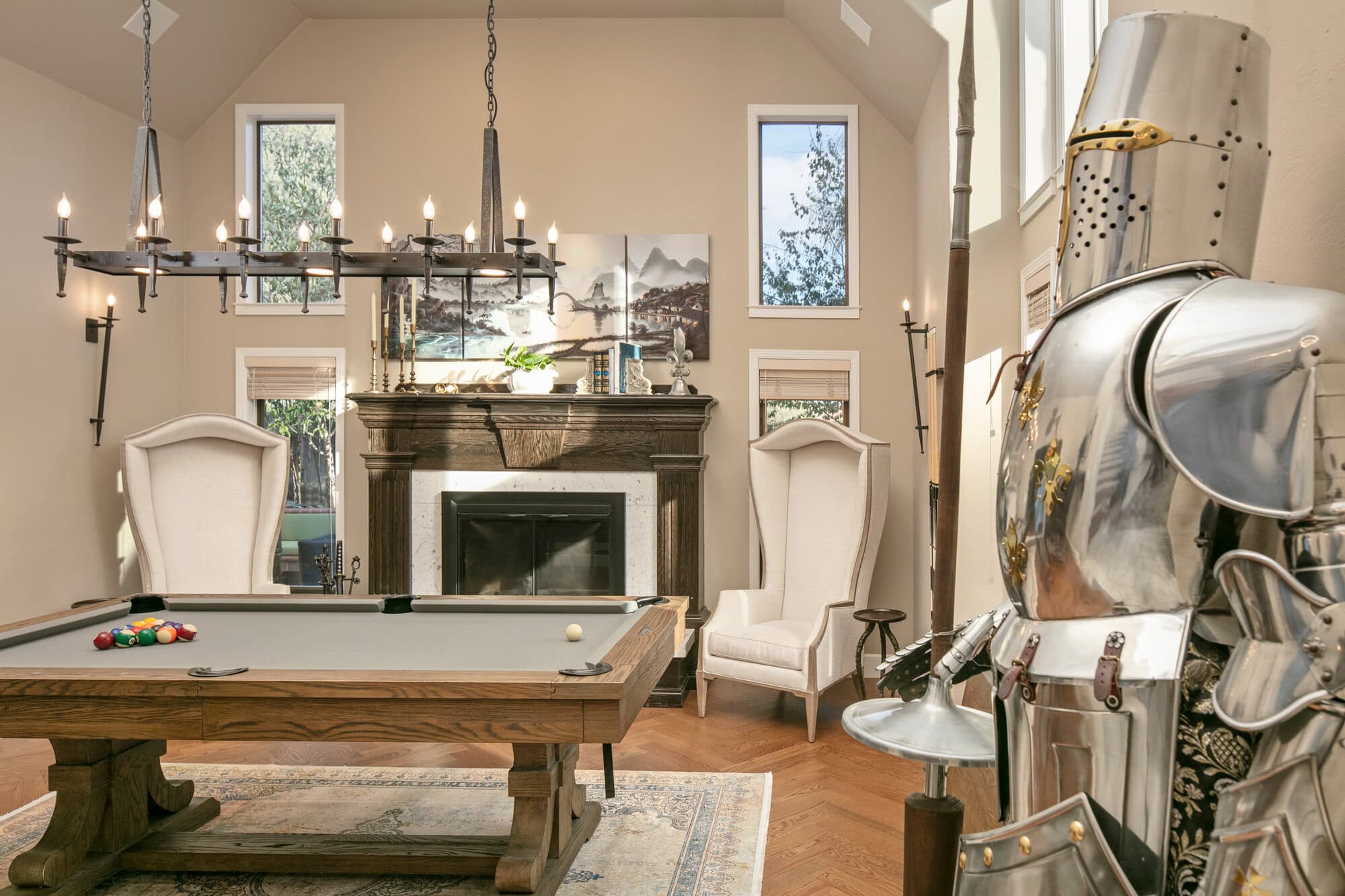 mens room with high ceiling, beige Stone Hearth walls, wood mantle, marble, pool table, oak floor, home decor. Kylie M.