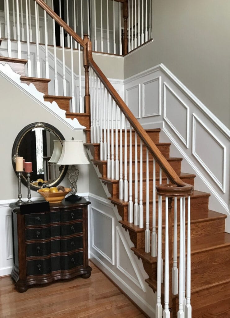 Red oak wood staircase, 1990s home, Benjamin Moore Revere Pewter, staircase with white and wood railing, wainscoting. Kylie M Interiors Edesign, online consulting blogger (2)