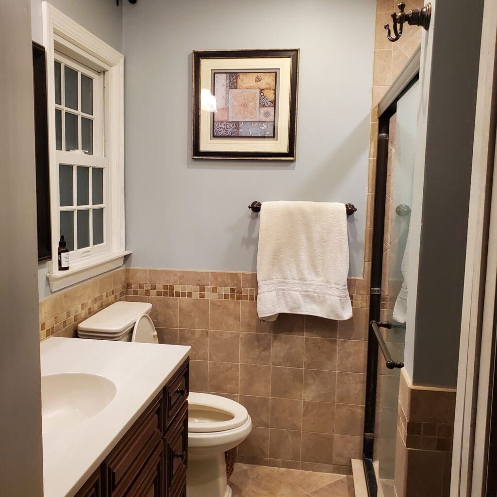 before update ideas, 2000s tuscan style bathroom with cherry red wood vanity cabinets, beige tile, oil rubbed bronze (1)