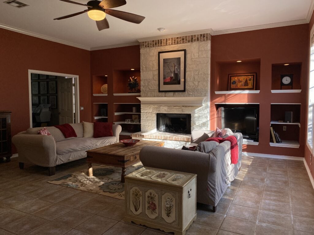 family room or living room before remodel beige stone fireplace (1)